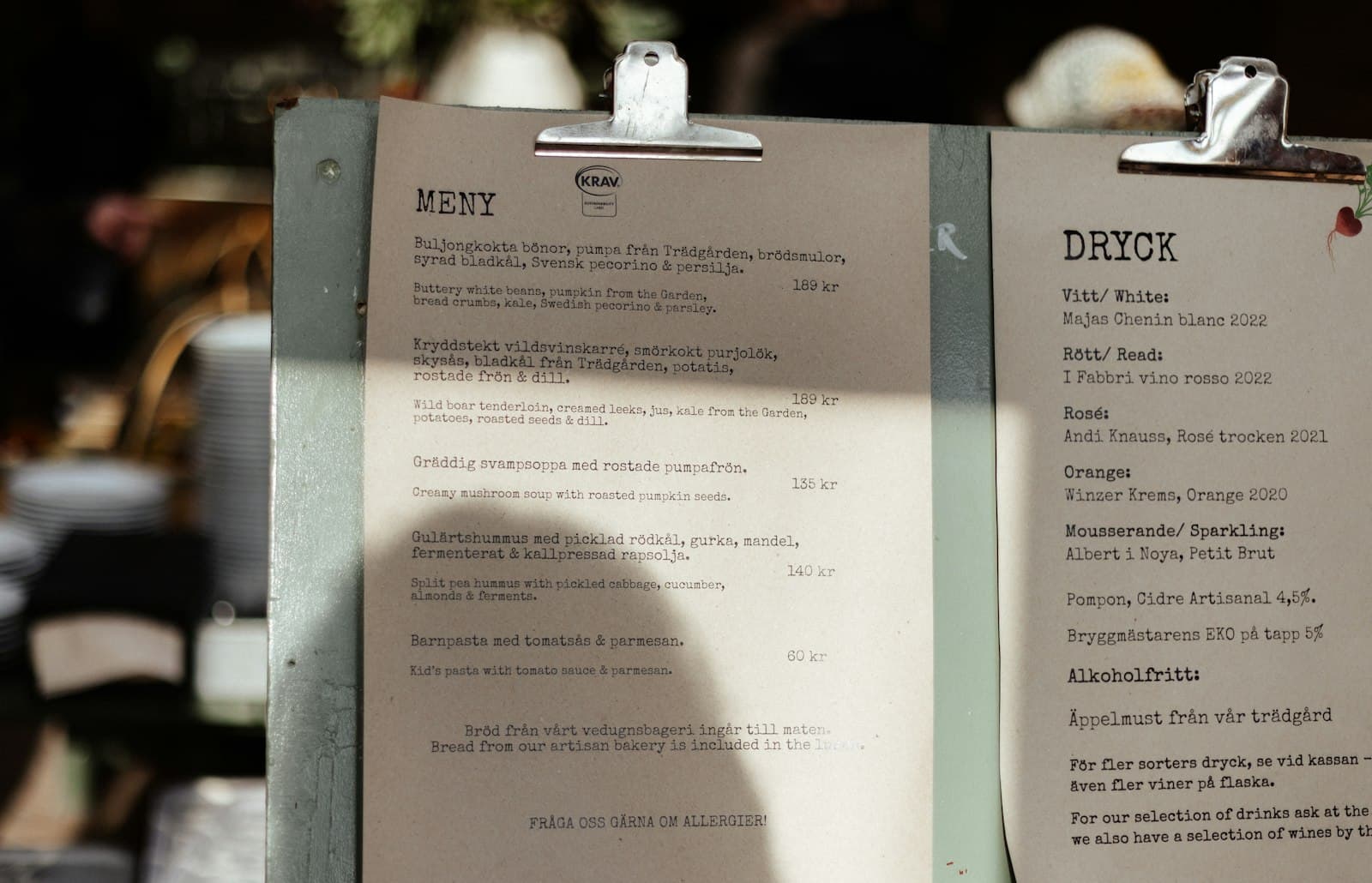 Paper lunch menu clipped to a board