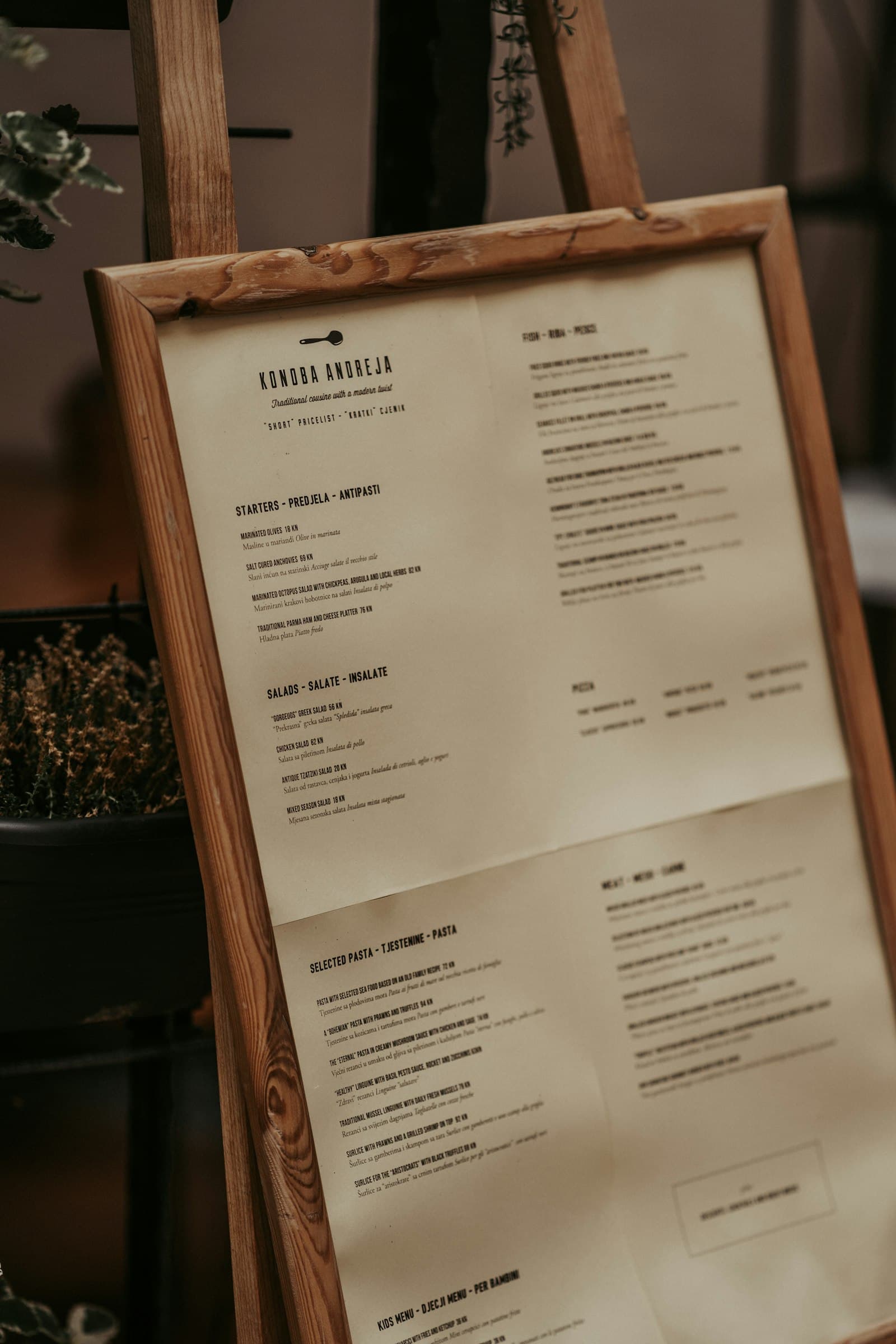 Framed restaurant menu with starters and pasta